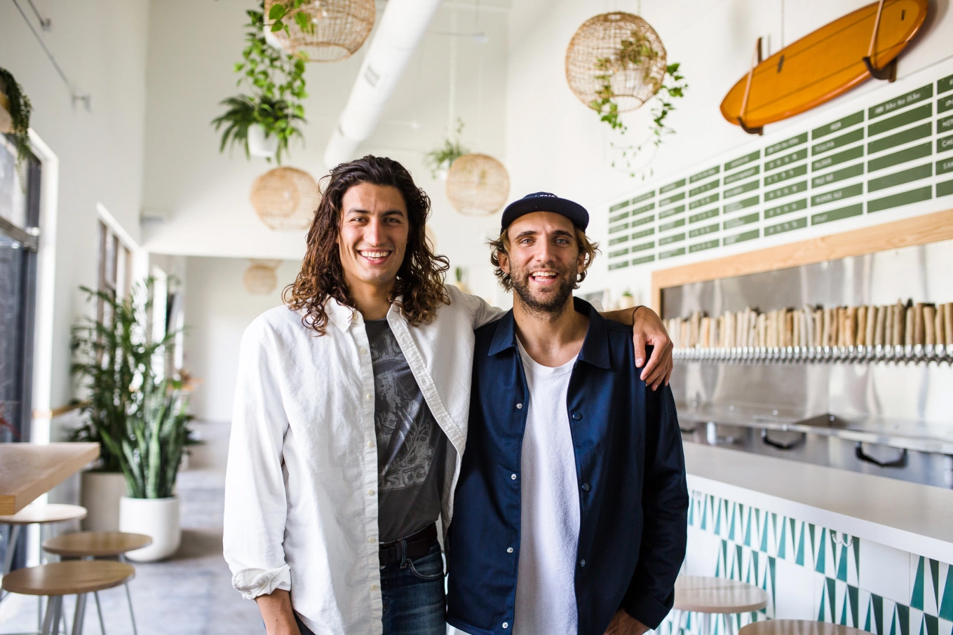 Juneshine founders pose in the tasting room.
